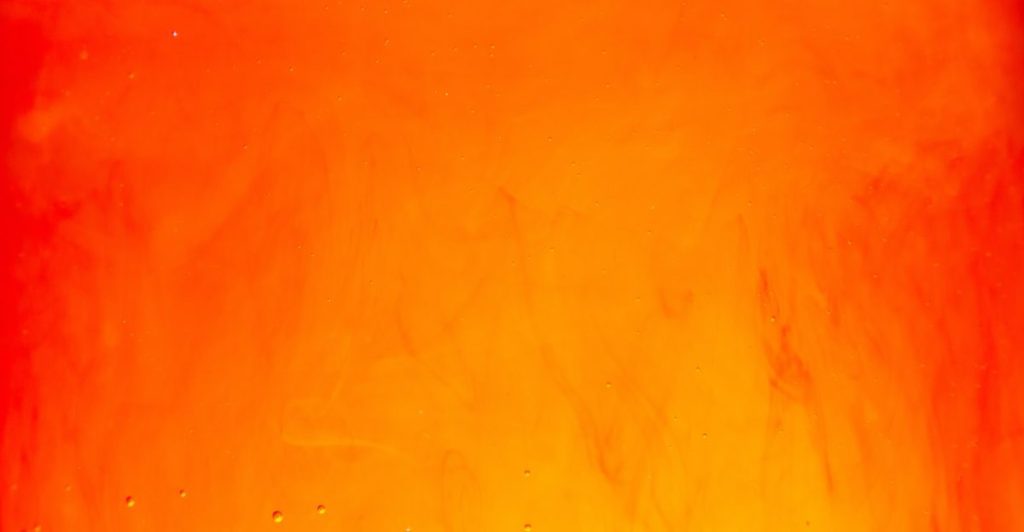 a close up of a fire with water drops on it